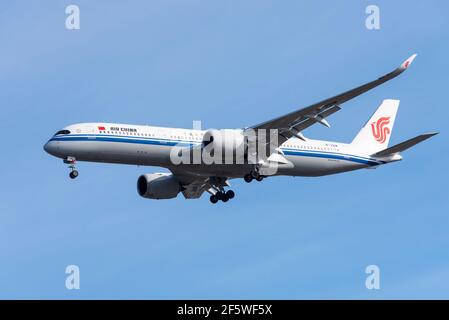 Air China Airbus A350 900 jet airliner plane B-321M on finals to land at London Heathrow Airport, UK, in blue sky. Chinese flag carrier airline. New Stock Photo