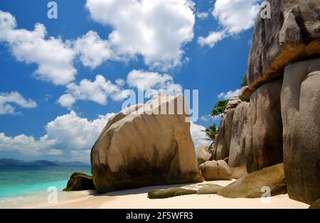 Tropical beach with big granite boulders on Coco Island, Indian ocean, Seychelles. Exotic destinations. Stock Photo