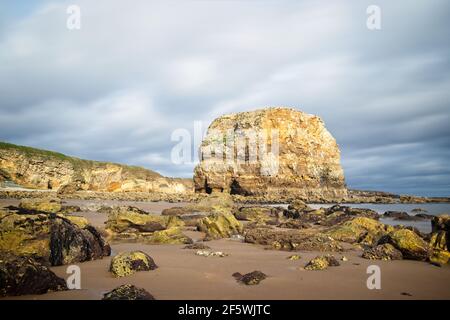 Marsden Rock is a sea stack standing on the North East coast of England near to Whitburn, Sunderland in Tyne and Wear. Stock Photo