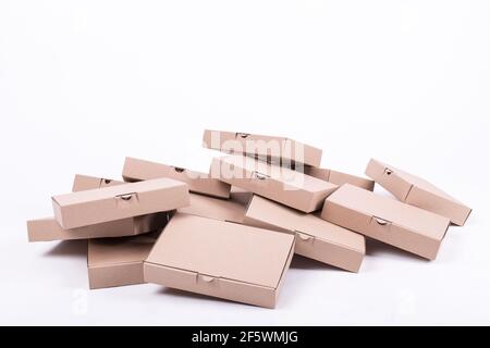 Stack of boxes of the same size isolated on white background, pile of carton boxes Stock Photo