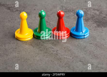 Game pieces with dices on slate Stock Photo
