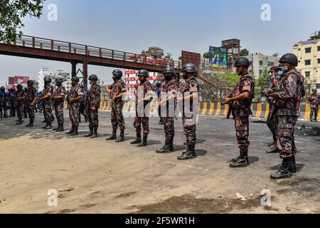 Dhaka, Bangladesh. 28th Mar, 2021. Border Guards Bangladesh (BGB) personnel stand on guard during the demonstration. Hefazat-e Islam activists took part during a nationwide strike following the deadly clashes with police over Indian Prime Minister Narendra Modis visit in Dhaka, Bangladesh. Credit: SOPA Images Limited/Alamy Live News Stock Photo