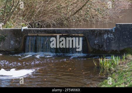 weir in a small canal Stock Photo