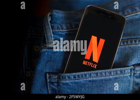 In this photo illustration a Netflix logo seen displayed on a smartphone. Stock Photo