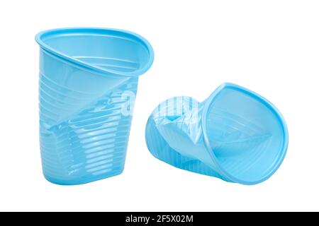 Crushed, damaged, discarded blue empty plastic cups, objects isolated on white background, cut out. Used plastic beverage cup trash, throwing away use Stock Photo