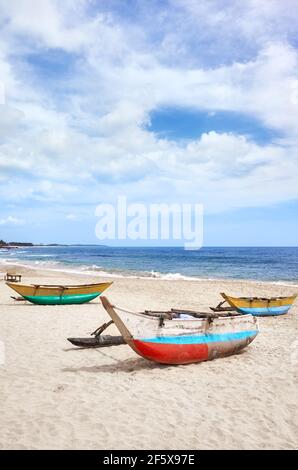 Small fishing boats on an empty beach, Sri Lanka. Stock Photo