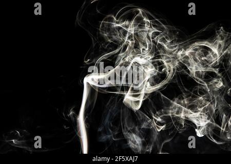 Grey smoke abstract texture, isolated effect with dark background Stock Photo