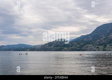 PENTICTON, CANADA - JULY 3, 2020: recreation time paddle boarding on scenic peaceful mountain lake Stock Photo