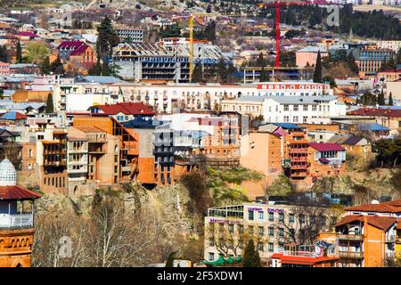 Old town and landmarks, historical buildings in Tbilisi. Tbilisi cityscape and view from Botanic garden. Stock Photo