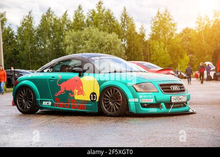 Moscow, Russia - July 06, 2019: Tuned Audi TT tightened by a special turquoise vinyl film. The car is sponsored by red bull racing. Parked on the street. Wrapping Stock Photo