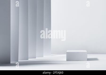 Elegant abstract white podium in sunlight with shadow, striped place with perspective on white background for product display. Simple modern geometric Stock Photo