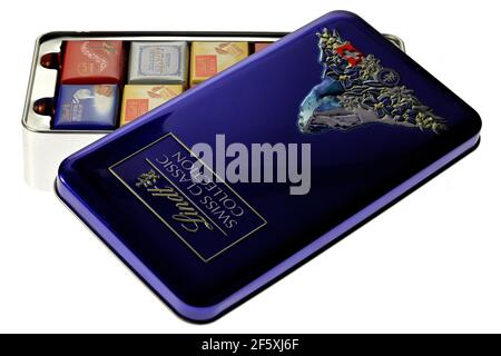 metal box with various Lindt chocolate bars isolated on white background Stock Photo