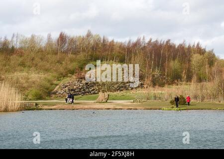 People near the lake and hill in Watergate Forest Park, Gateshead, north east England UK Stock Photo
