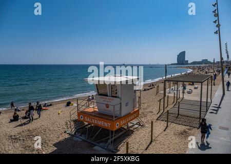 Barcelona, Spain. 28th Mar, 2021. View of a new watchtower for beach lifeguards that replace the traditional raised chairs on the beach at the coast of Barcelona.Barcelona's beaches kick off the new 2021 beach season with the deployment of 21 new watchtowers for beach lifeguards that replace traditional raised chairs. (Photo by Paco Freire/SOPA Images/Sipa USA) Credit: Sipa USA/Alamy Live News Stock Photo