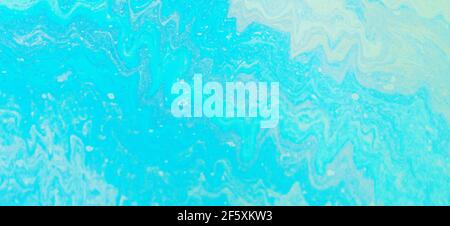 Blue, green, yellow color oil patterns on the surface of the water Stock Photo