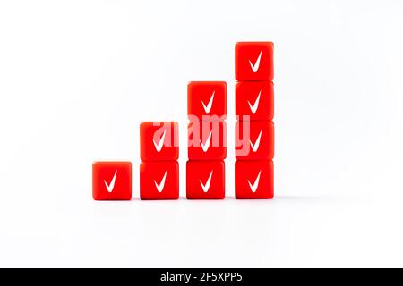 Business concept. Business, choice, decision.Copy space. Plastic red blocks with voting check marks. Plastic cubes on a white background for use in co Stock Photo