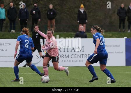 DURHAM CITY, UK. MARCH 28TH: Sheffield United's Katie WILKINSON lays the ball into the box past Kathryn HILL and Abby HOLMES during the FA Women's Championship match between Durham Women FC and Sheffield United at Maiden Castle, Durham City on Sunday 28th March 2021. (Credit: Mark Fletcher | MI News) Credit: MI News & Sport /Alamy Live News Stock Photo