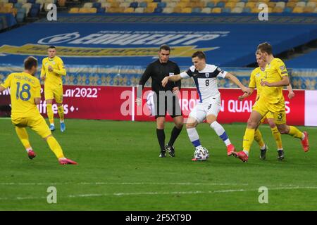 Kyiv, Ukraine . 28th Mar, 2021. KYIV, UKRAINE - MARCH 28, 2021 - Midfielder Robin Lod (C) of Finland controls the ball during the FIFA World Cup 2022 Qualifying Round Matchday 2 Group D game against Ukraine at the NSC Olimpiyskiy, Kyiv, capital of Ukraine. Credit: Ukrinform/Alamy Live News Stock Photo