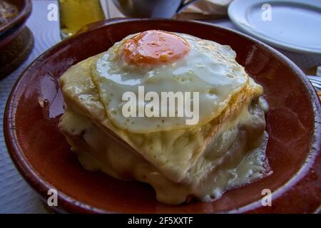 Francesinha is a typical food dish from the Porto region in Portugal. Stock Photo