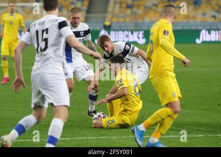 Non Exclusive: KYIV, UKRAINE - MARCH 28, 2021 - Midfielder Ruslan Malinovskyi (C) of Ukraine sustains an injury during the FIFA World Cup 2022 Qualify Stock Photo