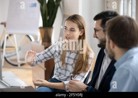 Smiling diverse businesspeople work together in office Stock Photo
