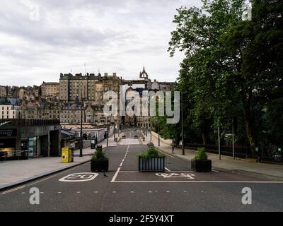 View of the Old Town from the Princes Street end of Waverley Bridge with no people and traffic during the coronavirus pandemic and lockdown. Stock Photo