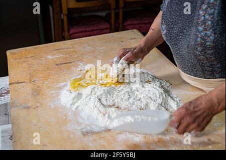 the grandmother preparing homemade pasta Stock Photo