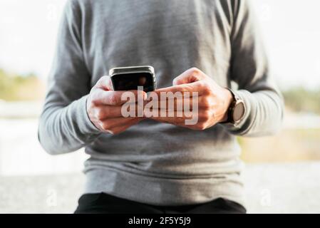 Close-up of a man using smartphone Stock Photo