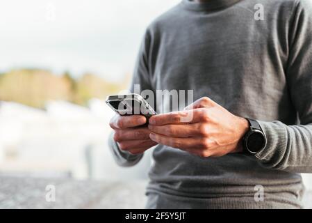 Close up of a man using smartphone Stock Photo