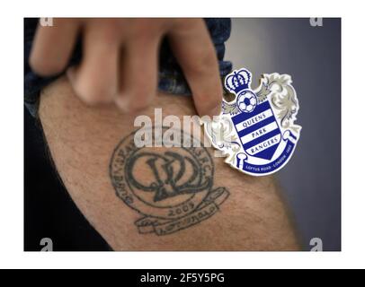 The new VIP improvements at Queens Park Rangers Loftus road stadium in west London. One fans tatoo of the old QPR logo, holding the new logo  photograph by David Sandison The Independent Stock Photo