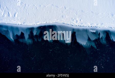 Ice peaks of shore under water Stock Photo