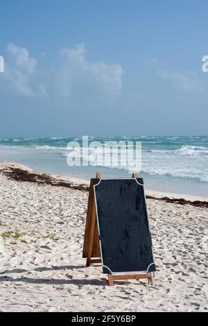 Blank blackboard on beautiful Caribbean beach at Tulum Mexico Stock Photo