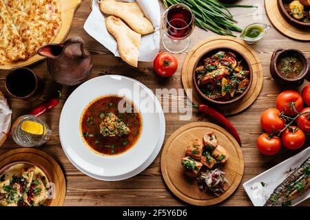 Georgian national kharcho soup on a wooden table Stock Photo