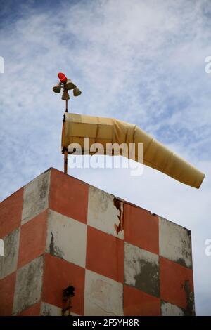 Airfield windsock, used to indicate wind speed and direction, shown ...