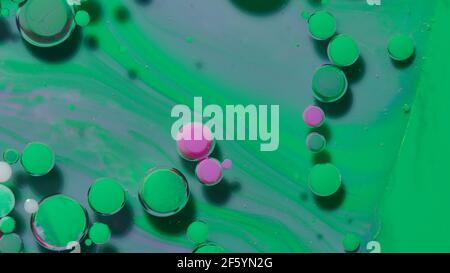 Colorful green pink bubbles surface wallpaper themes background, multicolor space universe concept Stock Photo