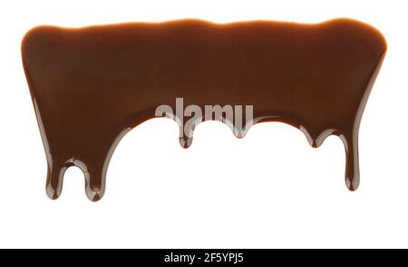 Pattern of melted chocolate pouring and dripping on white background Stock Photo