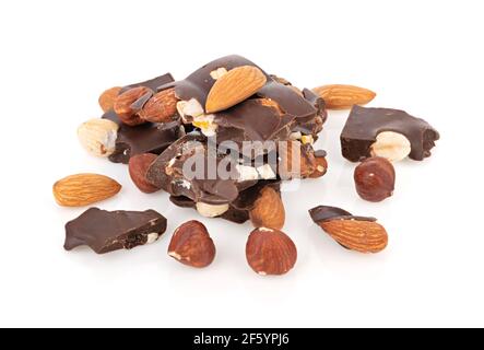 Heap of chocolate pieces with nuts on white background Stock Photo
