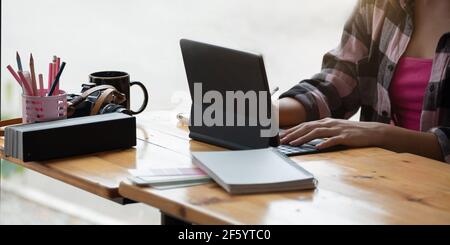 Asian Graphic Designer working with interactive pen display, digital Drawing tablet and Pen Stock Photo