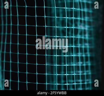distorted green wireframe grid on dark background,  Stock Photo