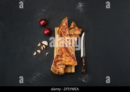 Air dried lamb ribs on wooden cutting board Stock Photo