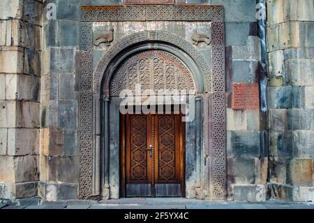 Beautiful ornate door with traditional Armenian ornaments at the Geghard monastery in Armenia Stock Photo