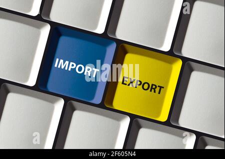 Import export buttons on computer keyboard e-commerce trade  Stock Photo