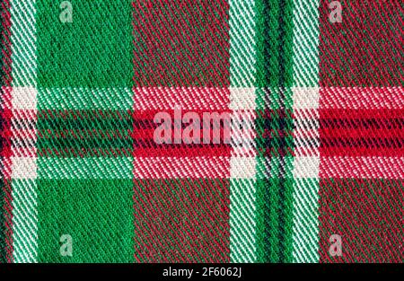 Old style wool weaving texture in red, green and white colors Stock Photo