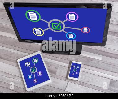 Validation concept shown on different information technology devices Stock Photo