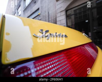 yellow Alfa Romeo Spider  GTV cabriolet roadster Stock Photo