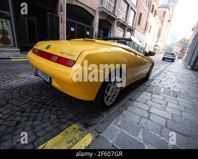 yellow Alfa Romeo Spider  GTV cabriolet roadster Stock Photo