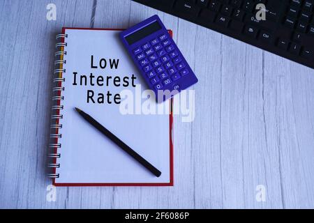 Text on notepad with pen, calculator and keyboard Stock Photo
