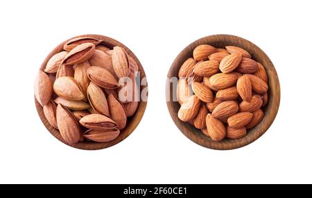 Studio shot of almonds on white background. Heap of almond isolated on white. Nuts in a bowl with copy space for text. Almonds close-up. Top view. Alm Stock Photo
