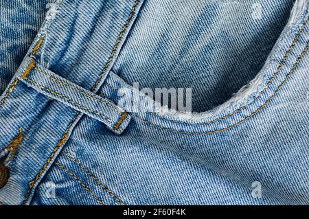 Denim jeans texture background. The texture of the cotton fabric. Close up. Stock Photo