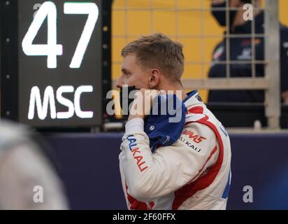 Sakhir, Bahrain. 28th Mar, 2021. German driver Mick Schumacher before taking the start of the Formula 1 Bahrain Grand Prix, the first of the season. Mick Schumacher managed to finish the race in the Bahrain Grand Prix in sixteenth position, in his debut in Formula 1, while his compatriot Sebastian Vettel was somewhat frustrated by his fifteenth place. Credit: Hasan Bratic/dpa/Alamy Live News Stock Photo